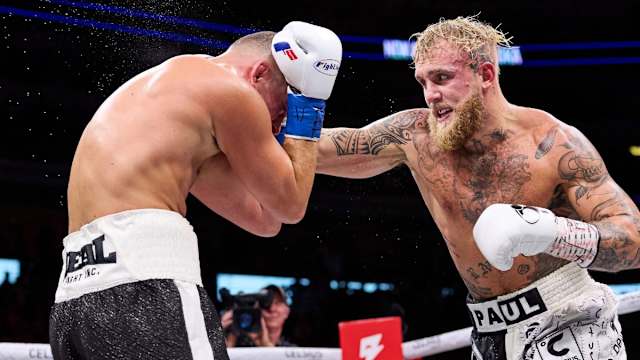 Jake Paul lands a punch on Nate Diaz, who partially blocked it.